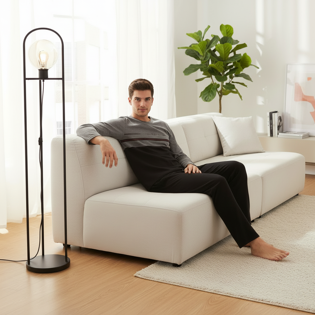Man in pajamas on sofa without iPad - square
